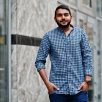 Stylish indian beard model man in casual clothes posed outdoor at street of India.